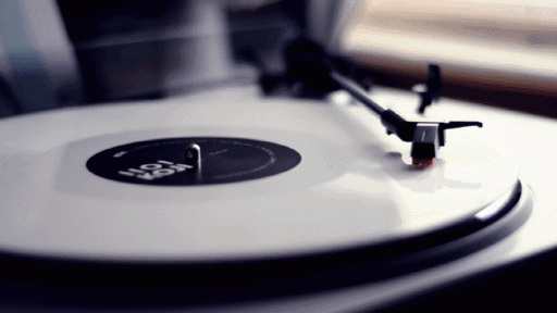 Vinyl record spinning on a turntable, evoking a nostalgic and retro atmosphere
